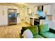 Well-lit kitchen featuring white cabinets, stainless steel appliances, and modern countertops at 1031 Lester Trl, Iron Station, NC 28080