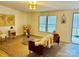 Chic living room with ample natural light, tasteful decor, and access to the deck at 1031 Lester Trl, Iron Station, NC 28080