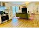 Open living space combining modern kitchen features with a comfy living area and a cozy fireplace at 1031 Lester Trl, Iron Station, NC 28080