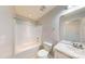 Bathroom featuring a shower-tub, a toilet, a sink, and a mirror on the wall at 10848 Tailwater St, Davidson, NC 28036