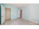 Bedroom featuring closet and connecting door to living area at 10848 Tailwater St, Davidson, NC 28036
