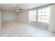 Light-filled bedroom with a ceiling fan and large windows at 10848 Tailwater St, Davidson, NC 28036