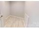 Walk-in closet with wood-style flooring at 10848 Tailwater St, Davidson, NC 28036