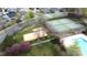 Aerial view of community amenities including a tennis court, volleyball court, and pool at 10848 Tailwater St, Davidson, NC 28036