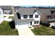 Well-maintained home featuring a two-car garage, and manicured lawn at 10848 Tailwater St, Davidson, NC 28036