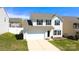 Attractive home featuring a two-car garage, neat lawn and classic suburban charm at 10848 Tailwater St, Davidson, NC 28036