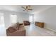 Neutral living room featuring light floors and recessed lighting at 10848 Tailwater St, Davidson, NC 28036