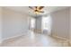 Bright living room with large windows and wood-style flooring at 10848 Tailwater St, Davidson, NC 28036