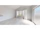 Bright living room features lots of light from the large window and clean, modern floors at 10848 Tailwater St, Davidson, NC 28036