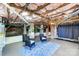 Unfinished basement with exposed beams, brick pillars, and painted concrete floors, offers potential for customization and expansion at 1110 S New Hope Rd, Gastonia, NC 28054