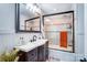 Bathroom features a modern sink, sleek fixtures, and tiled shower at 1110 S New Hope Rd, Gastonia, NC 28054
