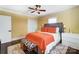 Comfortable bedroom with ceiling fan, closet, and stylish bed coverings at 1110 S New Hope Rd, Gastonia, NC 28054