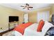 Comfortable bedroom with ceiling fan, closet, and stylish bed coverings at 1110 S New Hope Rd, Gastonia, NC 28054