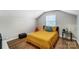 Cozy bedroom features a comfortable bed, hardwood floors, and natural light at 1110 S New Hope Rd, Gastonia, NC 28054