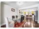 Dining room with a glass table and an open view to the kitchen at 1110 S New Hope Rd, Gastonia, NC 28054