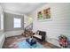 Bright entryway with seating, colorful window, and staircase leading to other areas at 1110 S New Hope Rd, Gastonia, NC 28054