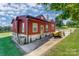 Unique exterior showcasing the home's vibrant siding, well-maintained yard and driveway at 1110 S New Hope Rd, Gastonia, NC 28054