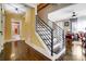 Hallway with decorative staircase, hardwood floors and access to other rooms at 1110 S New Hope Rd, Gastonia, NC 28054