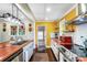 Updated kitchen features a center island with sink, white cabinets, and a red microwave at 1110 S New Hope Rd, Gastonia, NC 28054