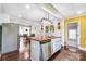 Open kitchen with stainless steel appliances and a large island, connecting to dining and living spaces at 1110 S New Hope Rd, Gastonia, NC 28054