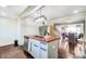 Open kitchen with stainless steel appliances and a large island, connecting to dining and living spaces at 1110 S New Hope Rd, Gastonia, NC 28054