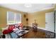 Bright living room with hardwood floors, large windows, and stylish furniture at 1110 S New Hope Rd, Gastonia, NC 28054