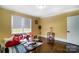 Bright living room with hardwood floors, large windows, and stylish furniture at 1110 S New Hope Rd, Gastonia, NC 28054