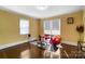 Bright living room with hardwood floors, large windows, and stylish furniture at 1110 S New Hope Rd, Gastonia, NC 28054