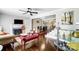 Elegant living room featuring a modern ceiling fan, fireplace, and staircase with glass bar at 1110 S New Hope Rd, Gastonia, NC 28054