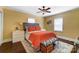 Comfortable primary bedroom with warm yellow walls, a queen bed, and stylish decor at 1110 S New Hope Rd, Gastonia, NC 28054