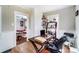 Charming home office with hardwood floors, desk, and access to the living room at 1110 S New Hope Rd, Gastonia, NC 28054
