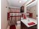 Cozy bathroom with a sink, toilet, and shower with a decorative curtain at 1135 Valley St, Statesville, NC 28677