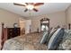 Bedroom featuring a bed with patterned bedding, hardwood floors, and a ceiling fan at 1135 Valley St, Statesville, NC 28677