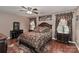 Well-decorated bedroom with stylish curtains, ceiling fan, and elegant furnishings at 1135 Valley St, Statesville, NC 28677