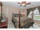 Bedroom featuring a bed with patterned bedding, carpet floors, and a ceiling fan at 1135 Valley St, Statesville, NC 28677