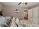 Comfortable bedroom featuring an open doorway, patterned bedding, and stylish decor at 1135 Valley St, Statesville, NC 28677