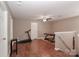 Second floor bonus room with dark wood laminate flooring, ceiling fan, and plenty of space at 1135 Valley St, Statesville, NC 28677