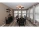 Elegant dining room with dark wood furniture, modern decor, and lots of natural light at 1135 Valley St, Statesville, NC 28677