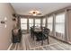 Elegant dining room with dark wood furniture, modern decor, and lots of natural light at 1135 Valley St, Statesville, NC 28677