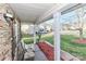 Covered front porch with stone accents, seating area and view of the street at 1135 Valley St, Statesville, NC 28677