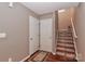 Entry hallway with staircase, showcasing hardwood floors and neutral wall color at 1135 Valley St, Statesville, NC 28677
