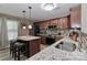 Spacious kitchen features stainless steel appliances, granite countertops, and a breakfast bar at 1135 Valley St, Statesville, NC 28677