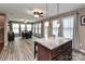 Open kitchen and dining area with lots of light and modern fixtures at 1135 Valley St, Statesville, NC 28677