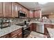 Charming kitchen with stainless steel appliances, backsplash, and custom cabinetry at 1135 Valley St, Statesville, NC 28677