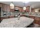 Beautiful kitchen with custom cabinets, stainless steel appliances, and granite countertops at 1135 Valley St, Statesville, NC 28677