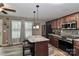 Kitchen featuring an island with seating, stainless steel appliances, and modern tile flooring at 1135 Valley St, Statesville, NC 28677