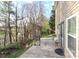Outdoor patio with barbecue grill, bench and door access to the backyard, ideal for entertaining at 1135 Valley St, Statesville, NC 28677