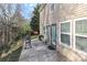 View of an outdoor patio with grill, bench, and access to the home, providing a seamless indoor-outdoor experience at 1135 Valley St, Statesville, NC 28677