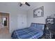 Comfortable bedroom with a ceiling fan, and a double door closet at 119 Capital Ave # E, Mooresville, NC 28117