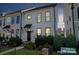 Charming two-story home featuring a modern facade with a well-maintained front yard at 119 Capital Ave # E, Mooresville, NC 28117